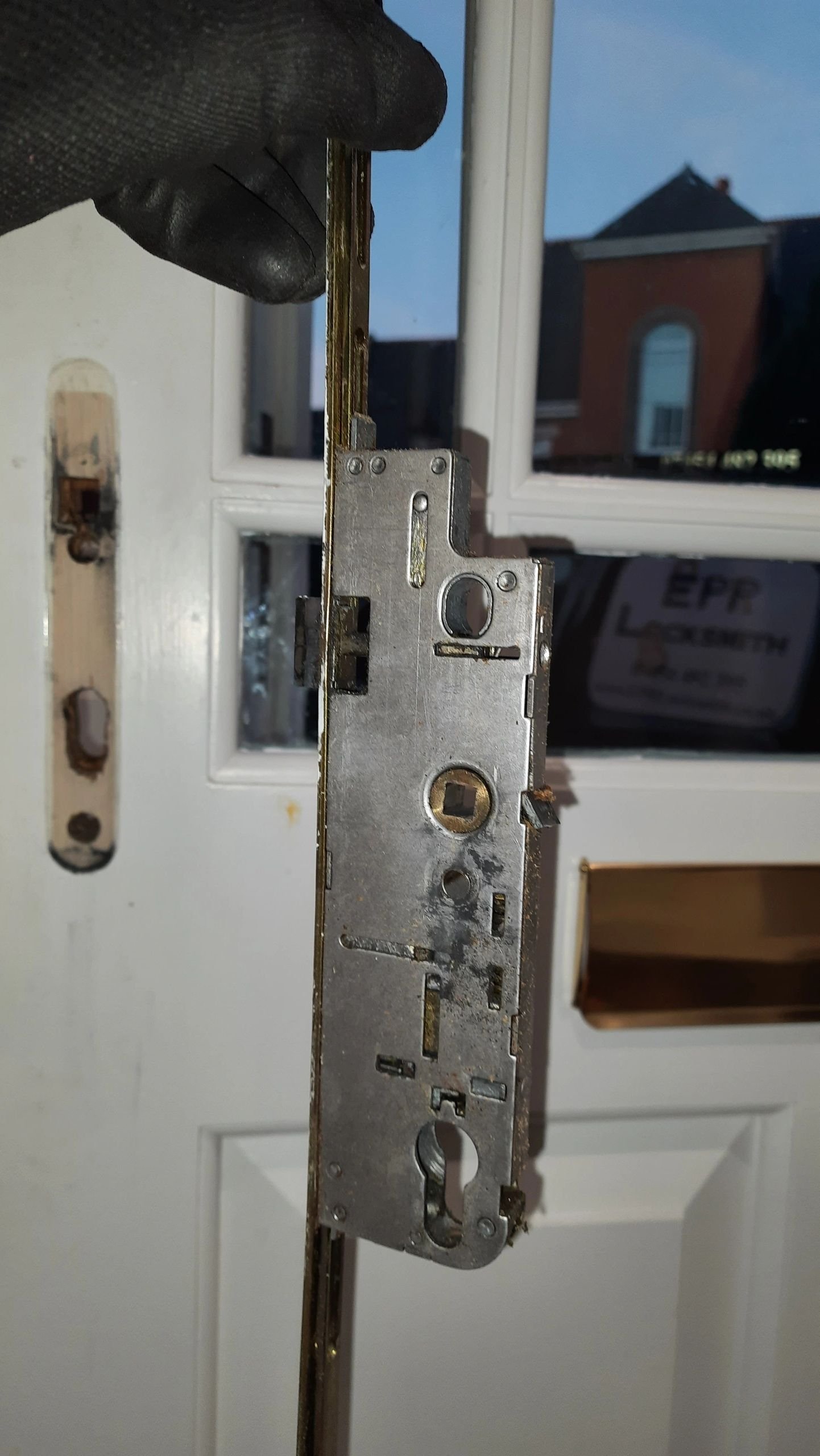 Full-length multipoint locking system replacement on a wooden door in Windsor